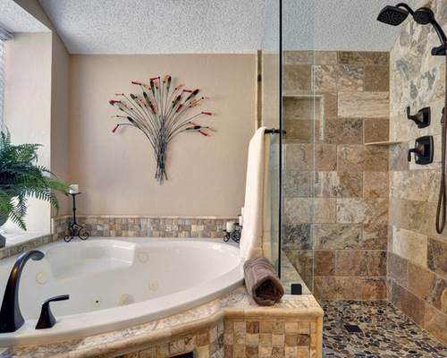 A bathroom with a popcorn ceiling and decorative tile.