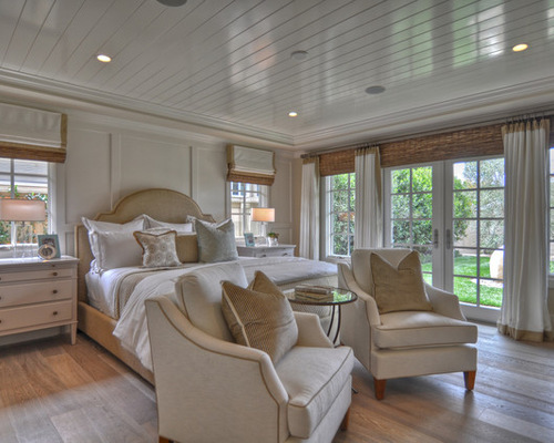 A bedroom with beadboard, a common alternative for a popcorn ceiling.