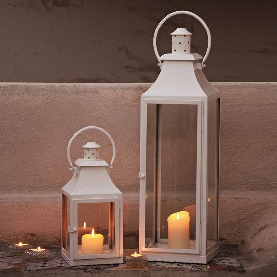 24 Unique Beautiful DIY Garden Lanterns - 18. RECYCLED WOOD SCRAPS HOLDING DELICATE CANDLES
