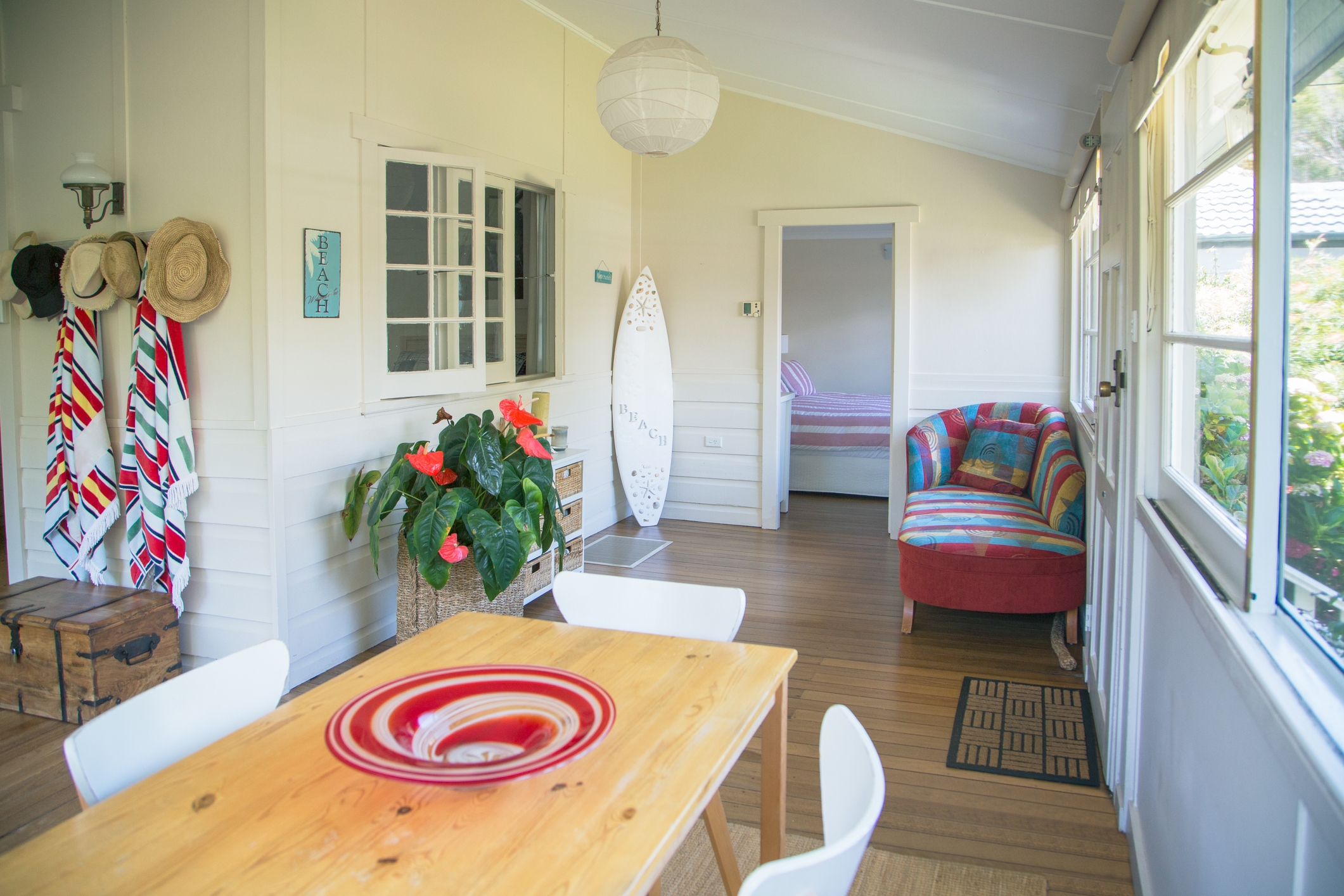 A beach house living room with colorful decorations.