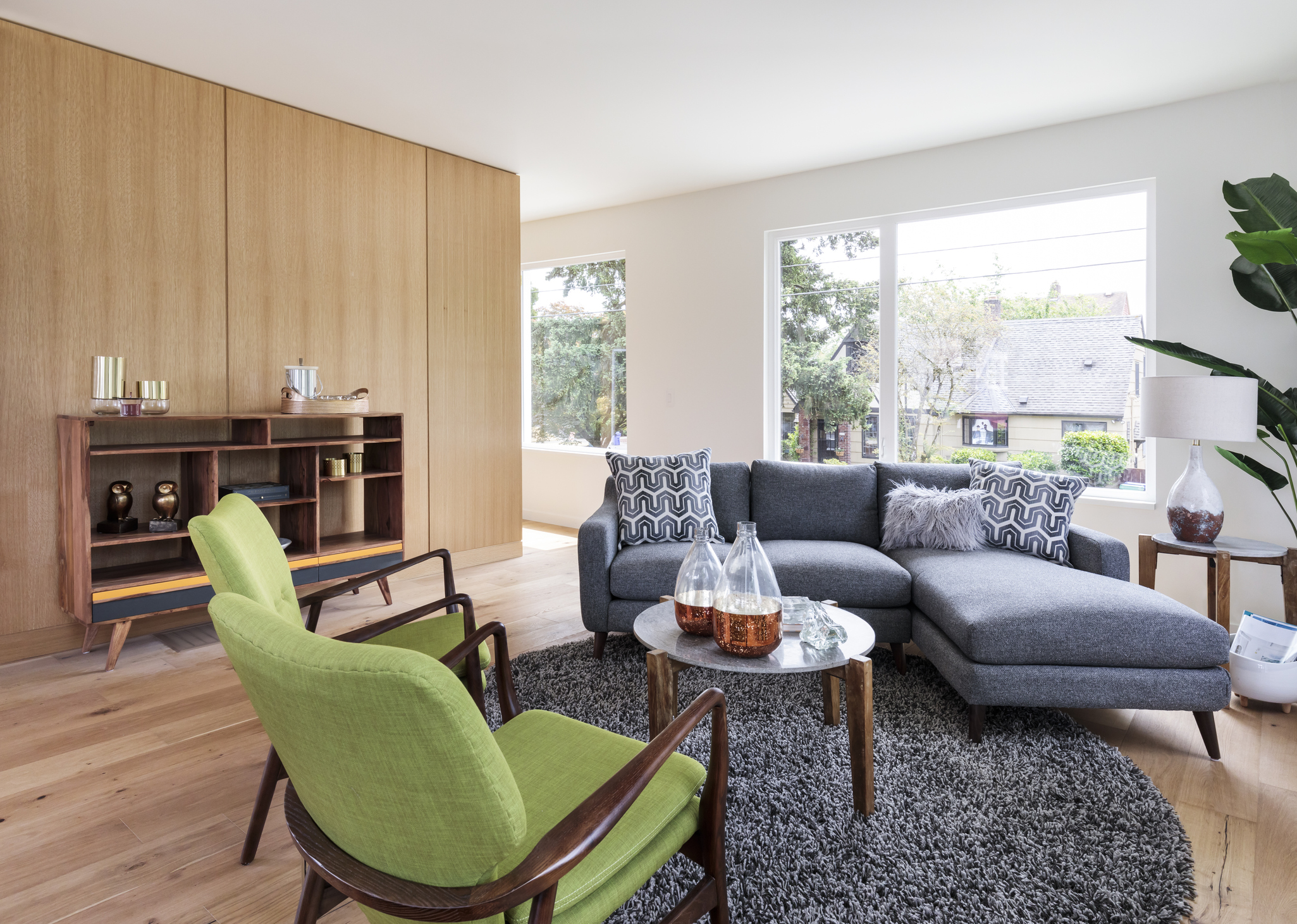 A living room decorated with mid-century modern furniture.