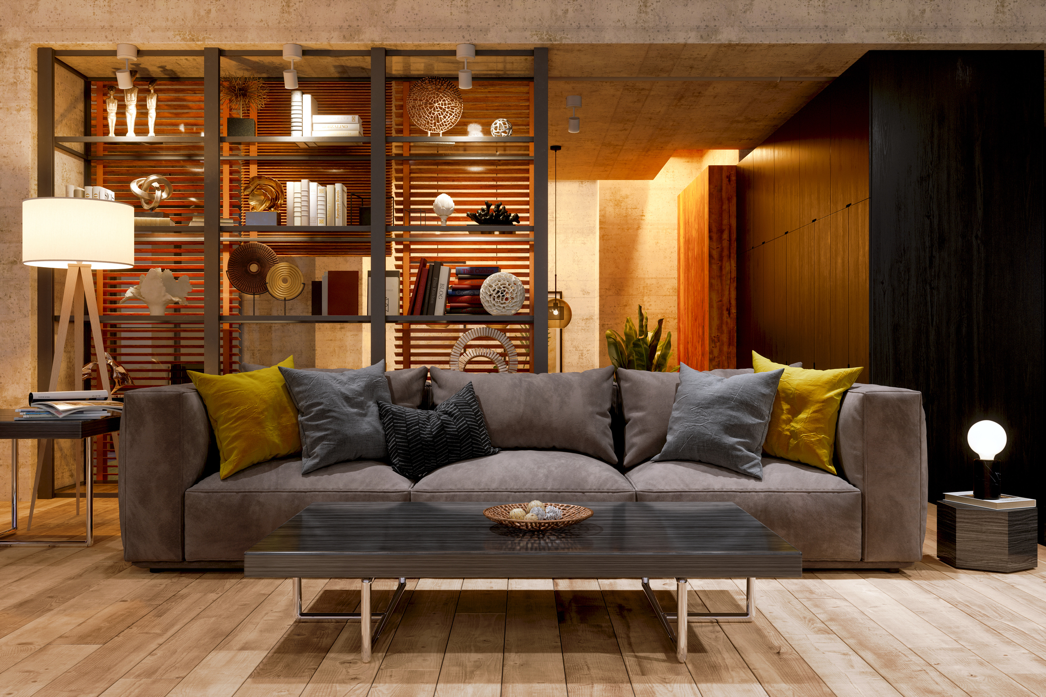 A colorful living room with orange and yellow accents, a houseplant, and a large bookshelf behind the couch.