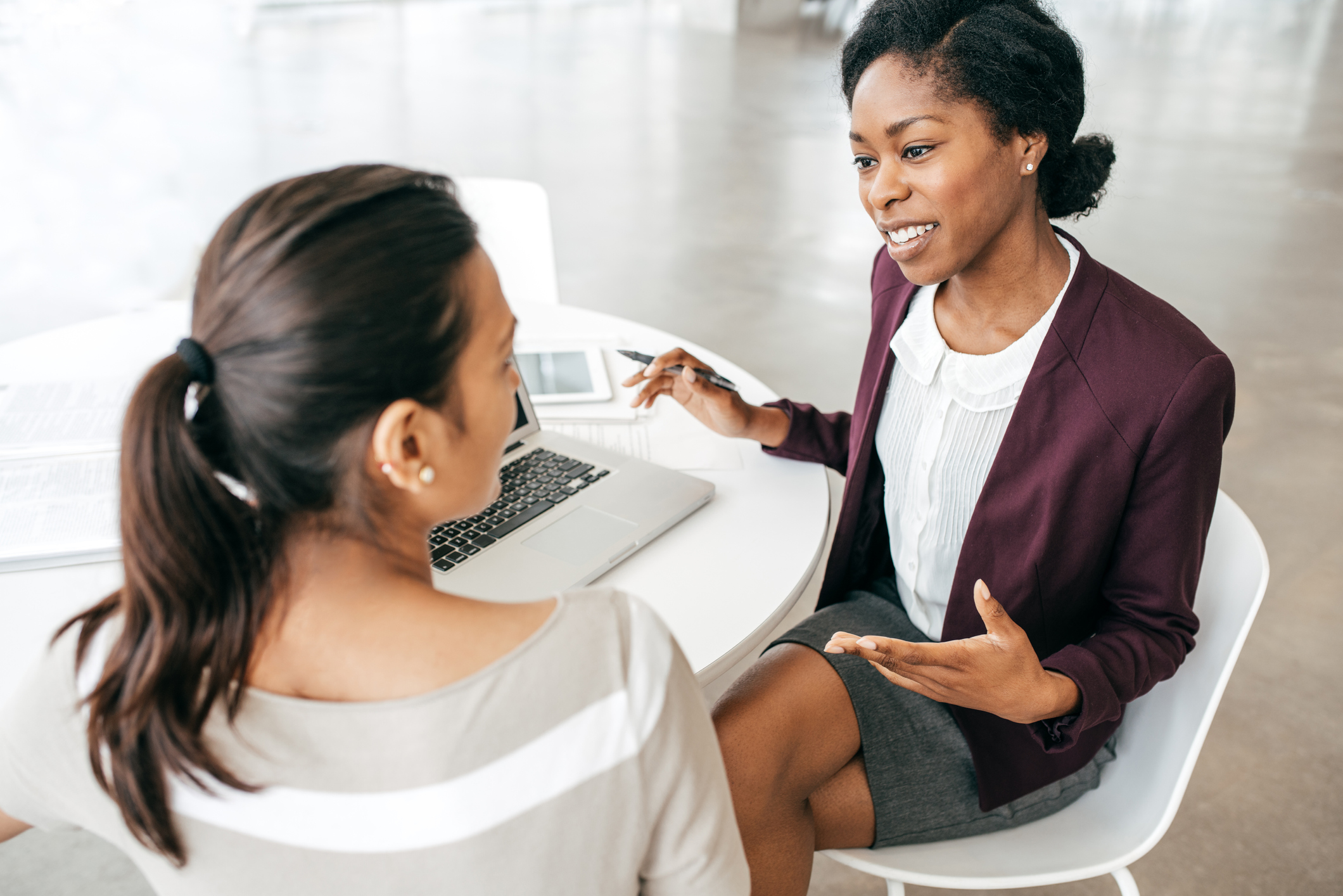 Two women discussing the terms of a mortgage application