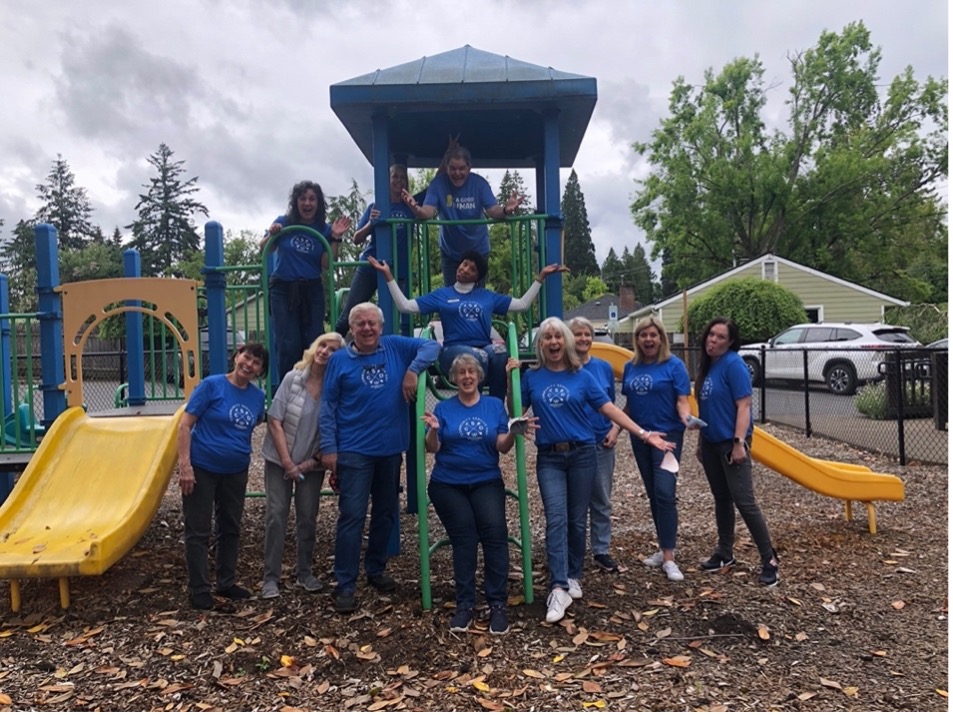 A group of agents and staff from Windermere Lake Oswego at a playground on Community Service Day 2022.
