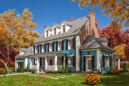 A profile shot of a turquoise and white American Colonial home with a brick chimney