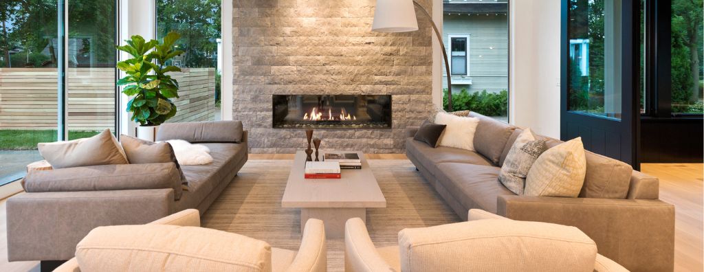 A living room with neutral colored modern décor staged in preparation for an open house