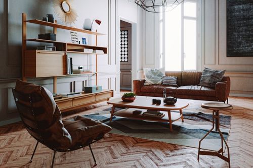 A mid-century modern living room with a herringbone hardwood floor, low leather couch and matching chair with black metal framing, a minimalist bookshelf, and a small coffee table with wooden peg legs.