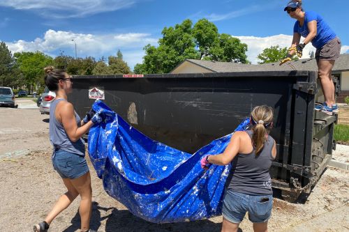 A group of real estate agents from the Fort Collins and Windsor Windermere offices in Colorado volunteering together on Community Service Day 2023.