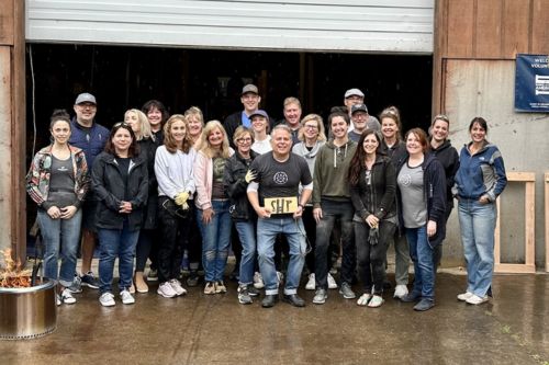 A group of real estate agents from the Portland MLK Windermere office volunteering together on Community Service Day 2023.
