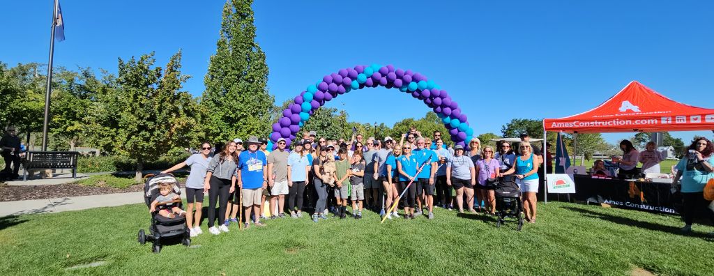 A group of staff from Windermere Utah at the Out of the Darkness Community Walk to Benefit the American Foundation for Suicide Prevention.